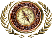 compass atop a bowl of roasted coffee beans set inside gold laurels